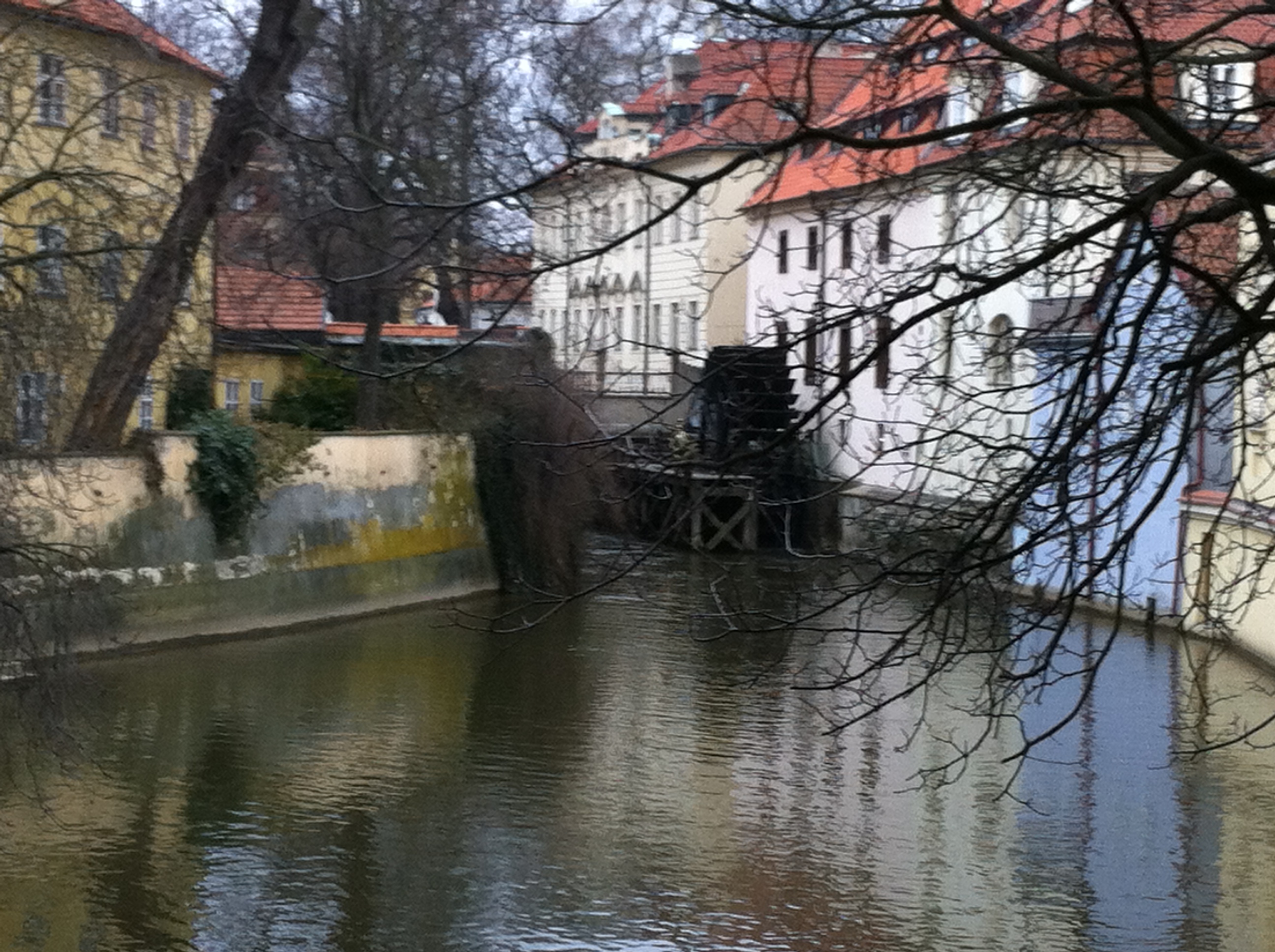 This view of the Devil's Stream (called Čertkova in Prague), under the Charles Bridge, shows a water wheel of a medieval mill. There were once several such mills along the stream which runs alongside the Vltava River. 