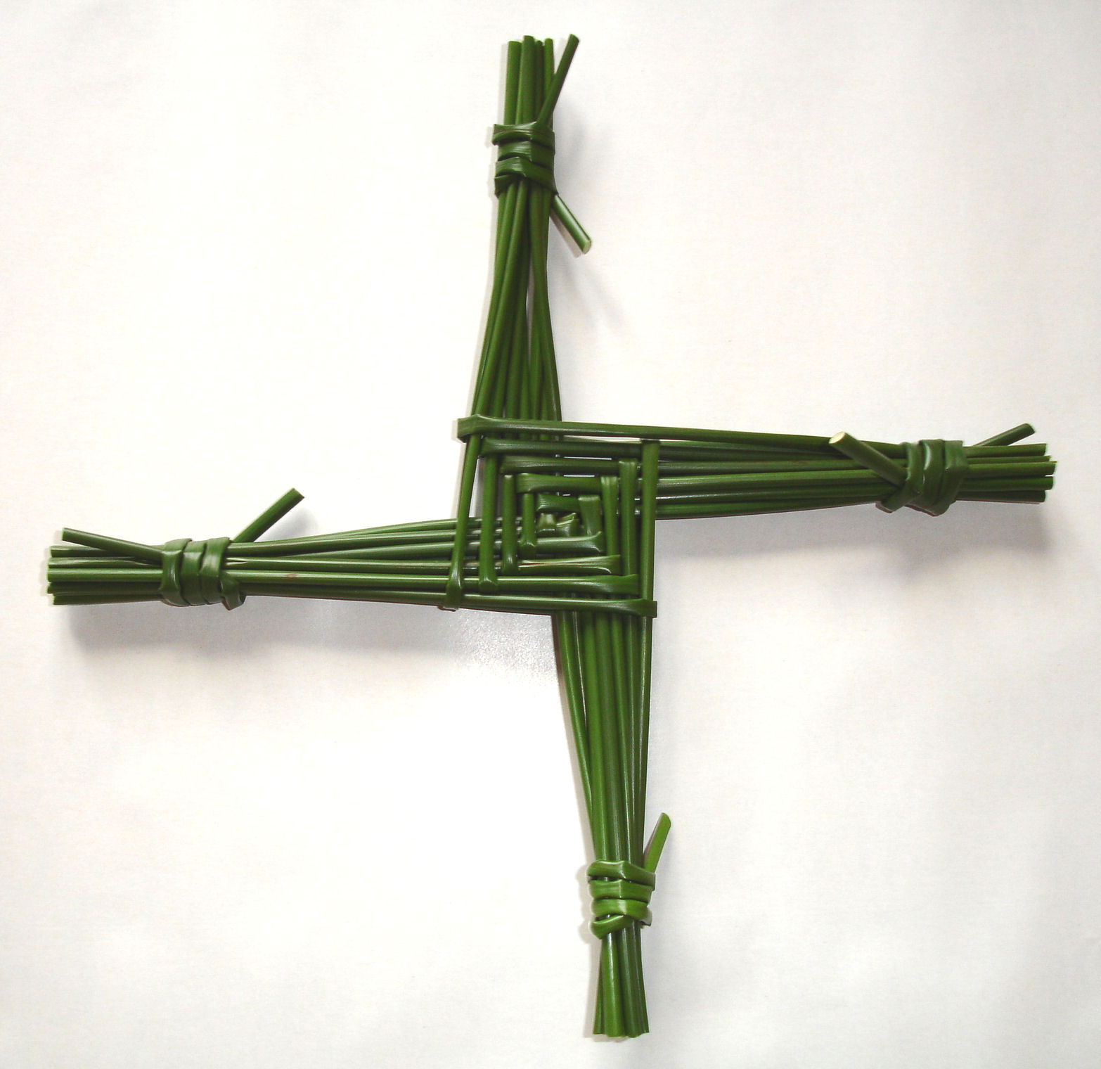 Legend says that while St. Brigit sat alongside a dying man one night, she picked up a handful of rushes from the floor and wove a cross, explaining the Gospel to the dying man as she made the cross. Nowadays many make similar crosses and hang them up to protect their house or barn until the next February.