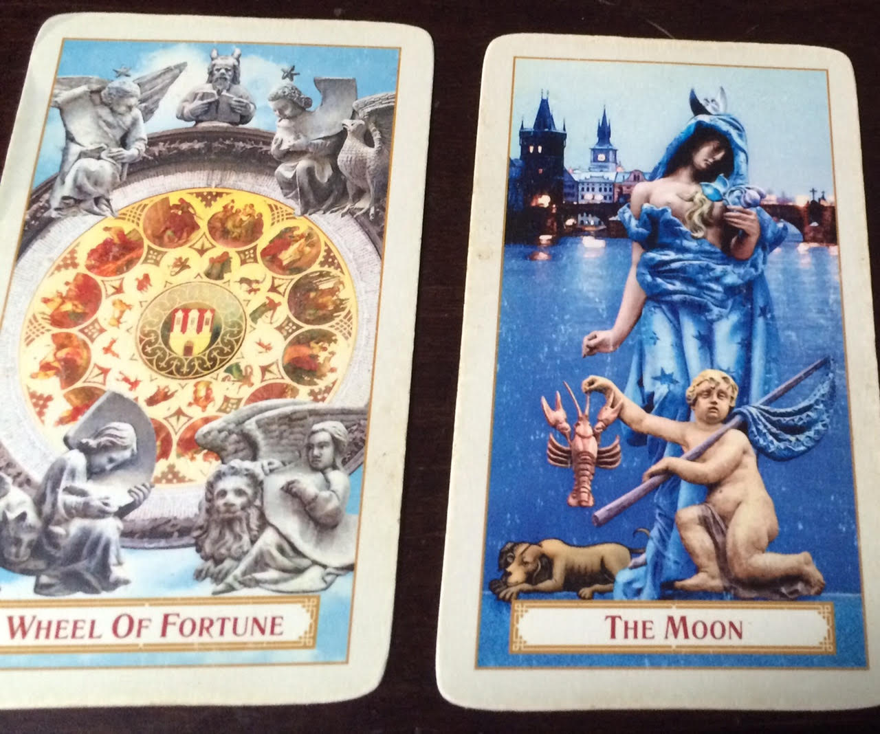 The Wheel of Fortune and The Moon -- shown here from the Tarot of Prague deck, available from Baba Studios -- are both associated with Pisces.