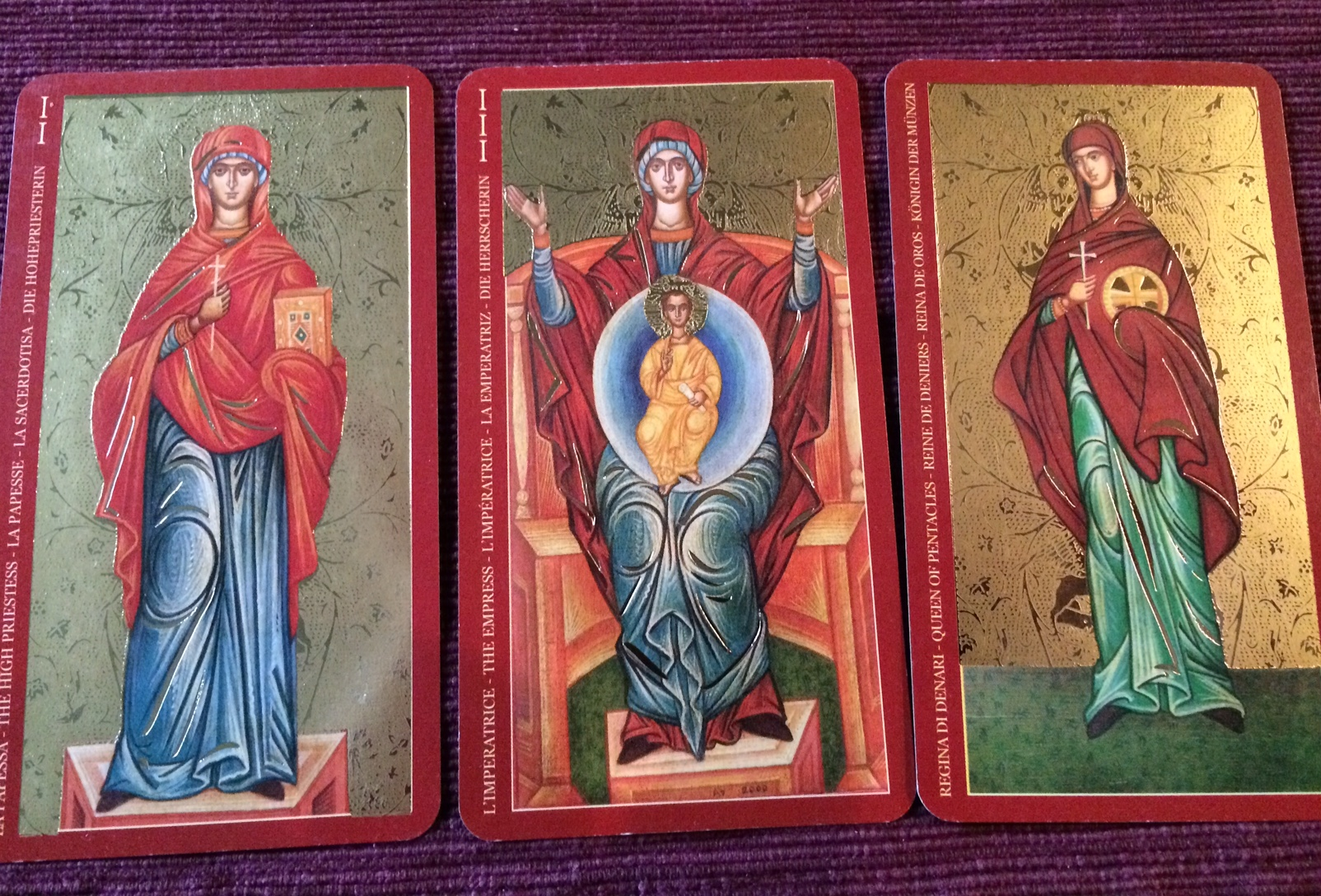 "The Golden Tarot of the Tsar" (by A.A.. Atanassov and available thru Lo Scarabeo) depicts the Mother of God as the Empress, St. Parasceva as the High Priestess, and an anonymous woman martyr as the Queen of Pentacles.